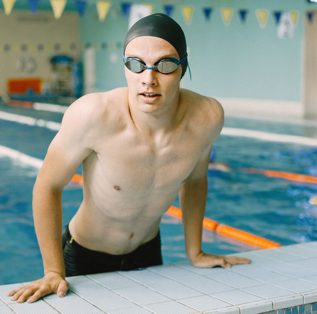 Swimmer training in an indoor pool.
